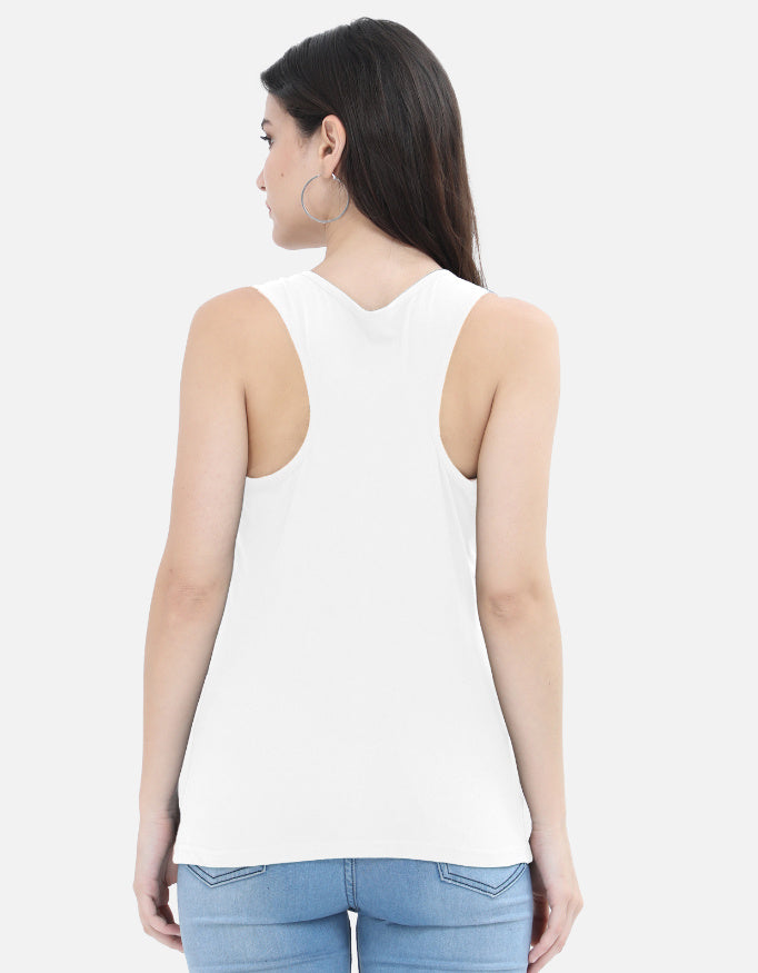 Woman in white sleeveless top and jeans, back view, Nairove Closet trendy casual fashion