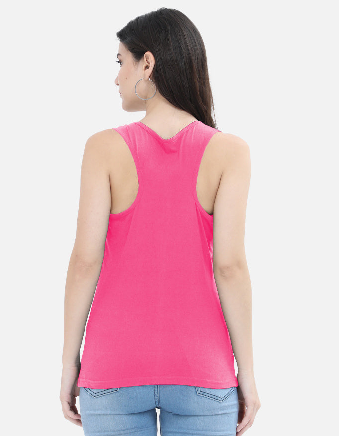 Woman wearing pink racerback tank top and light blue jeans, Nairove Closet fashion