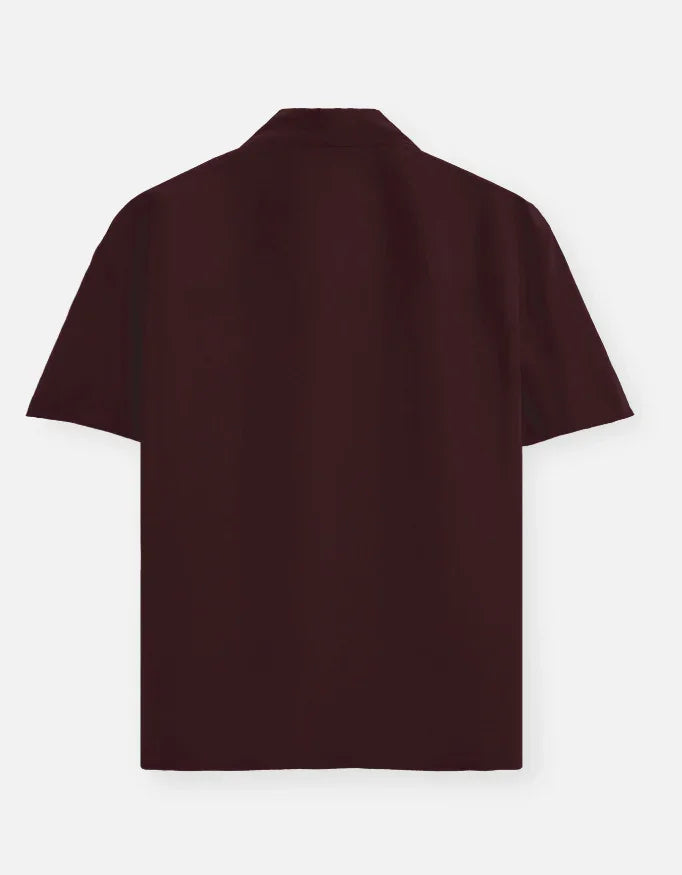 Back view of a dark brown short-sleeve shirt from Nairove Closet on plain background