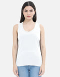 Woman wearing white sleeveless top and blue jeans, Nairove Closet fashion collection