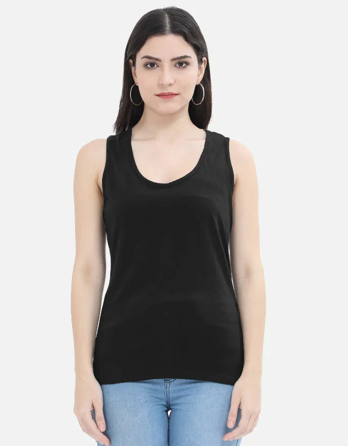 Woman in black sleeveless top and blue jeans from Nairove Closet fashion collection