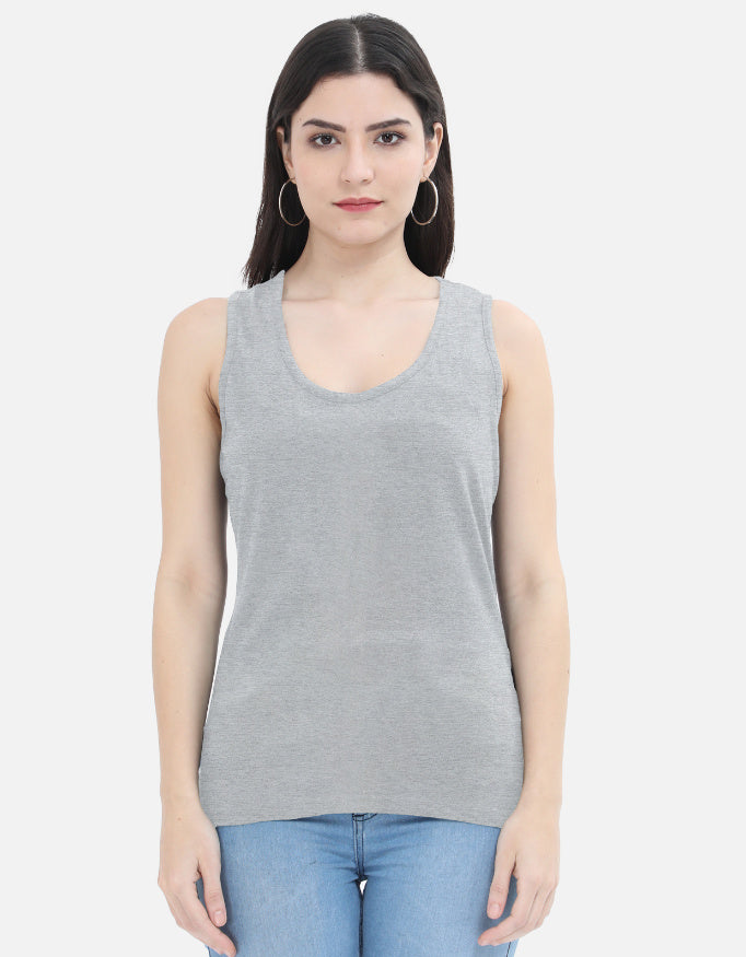 Woman wearing grey sleeveless tank top and blue jeans, Nairove Closet fashion collection