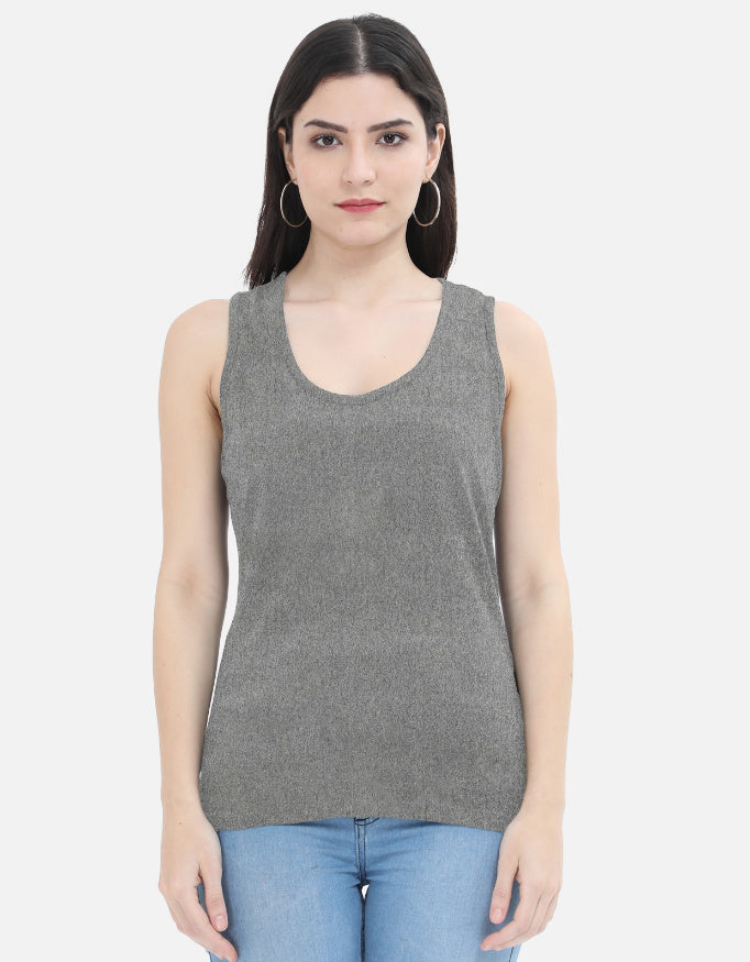 Woman wearing grey sleeveless top and blue jeans, Nairove Closet fashion collection